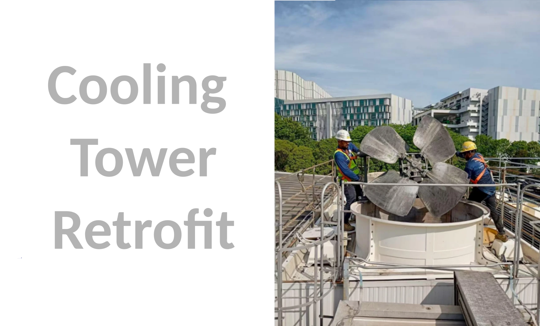 Cooling-tower retrofit work with technicians handling the original fan assembly